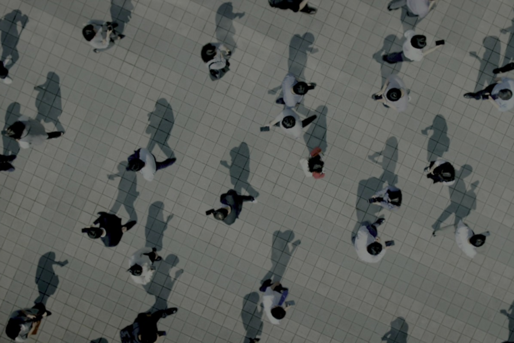 overhead view of business people walking down a street all looking very similar