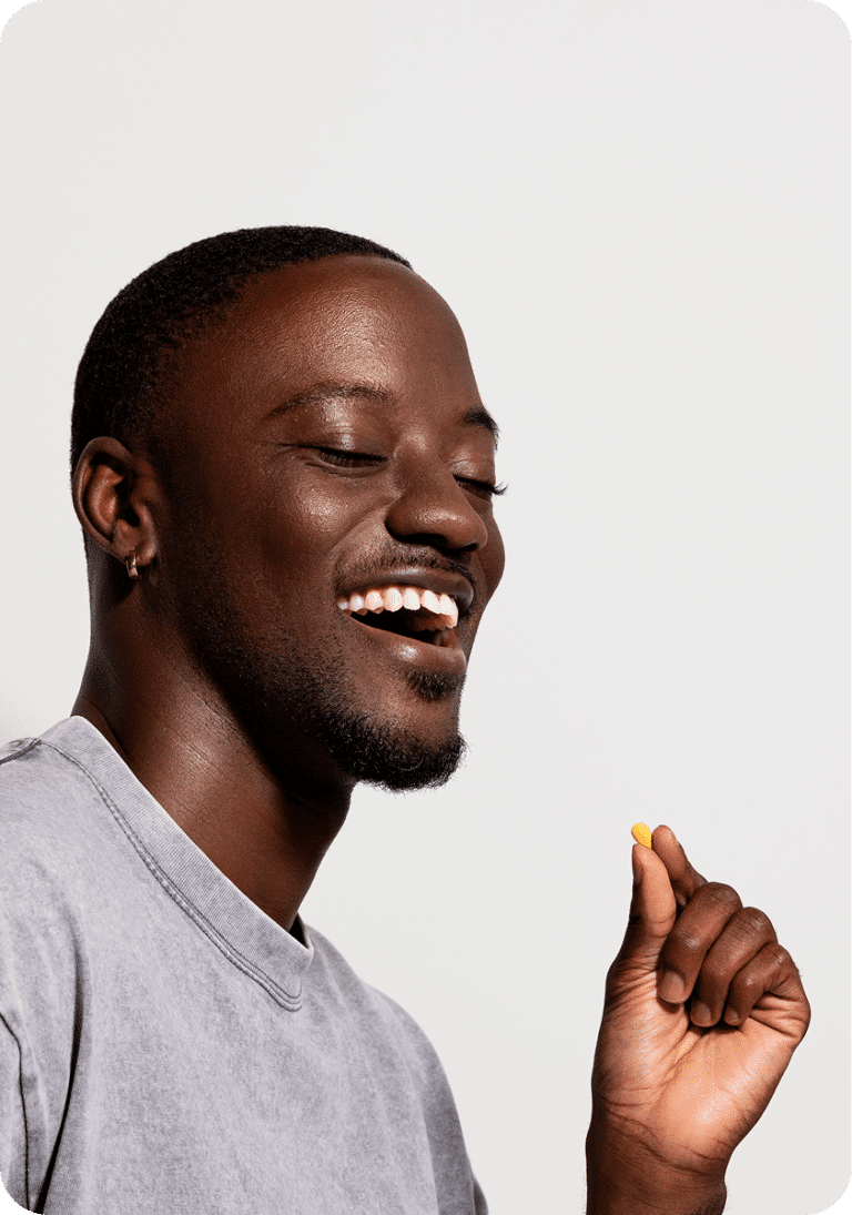 Person smiling while holding a tablet